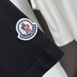 Flat lay presentation of Moncler luxury clothing with relaxed-fit cut