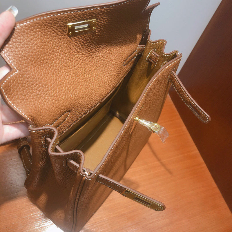 Side view of streamlined structured handbag