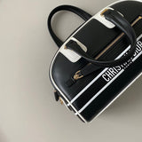 Styled lifestyle shot of signature everyday-luxe women's handbag – women's designer-style accessory