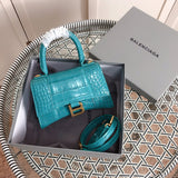 Side profile of structured polished women's handbag – women's luxury accessory