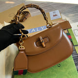 Back view of polished sleek women's handbag – women's statement bag