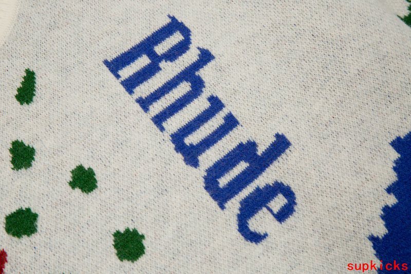 Flat lay presentation of Rhude luxury clothing with monogram-inspired silhouette