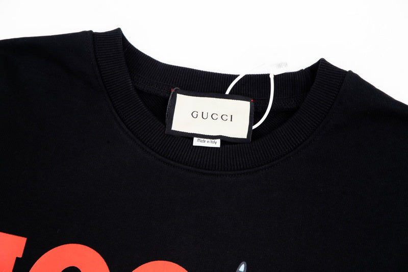 Close-up detail shot of Gucci luxury clothing with relaxed-fit cut
