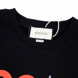 Close-up detail shot of Gucci luxury clothing with relaxed-fit cut