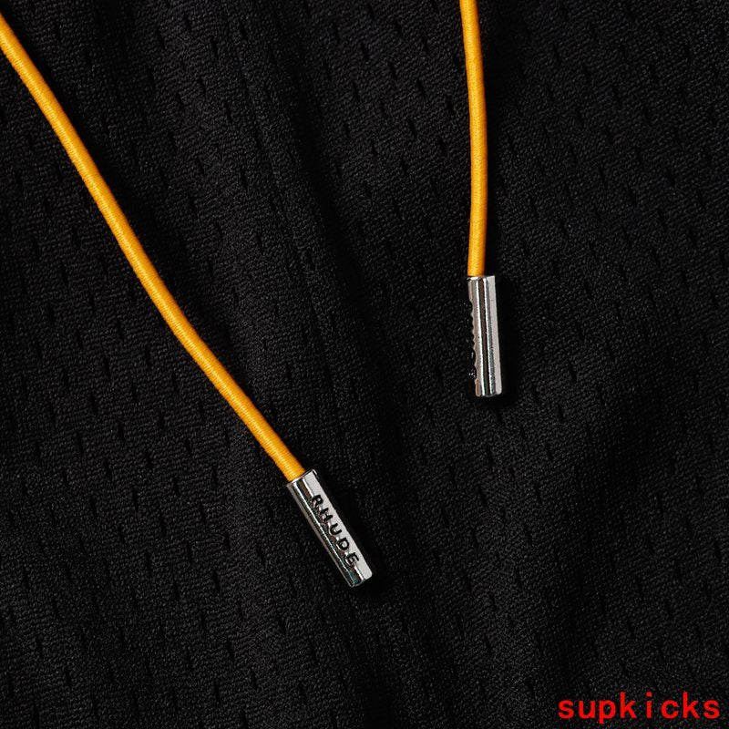 Close-up detail shot of Rhude luxury clothing with logo-detail design