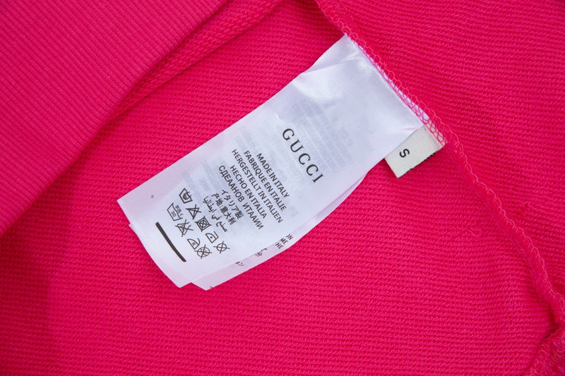 Close-up detail shot of Gucci luxury clothing with everyday silhouette