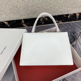 Front view of sleek classic women's handbag – women's luxury handbag