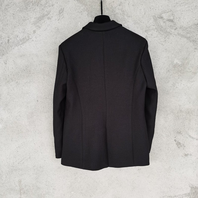 Side profile of Louis Vuitton luxury clothing with logo-detail design