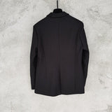 Side profile of Louis Vuitton luxury clothing with logo-detail design