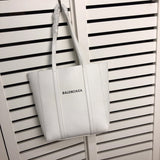 Front view of structured elevated women's handbag – women's designer-style accessory