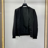 Side profile of Louis Vuitton luxury clothing with label-forward styling