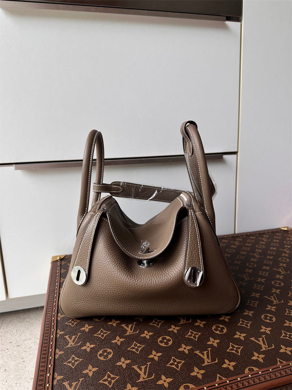  Timeless top-handle bag carried on shoulder 16