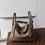  Timeless top-handle bag carried on shoulder 16
