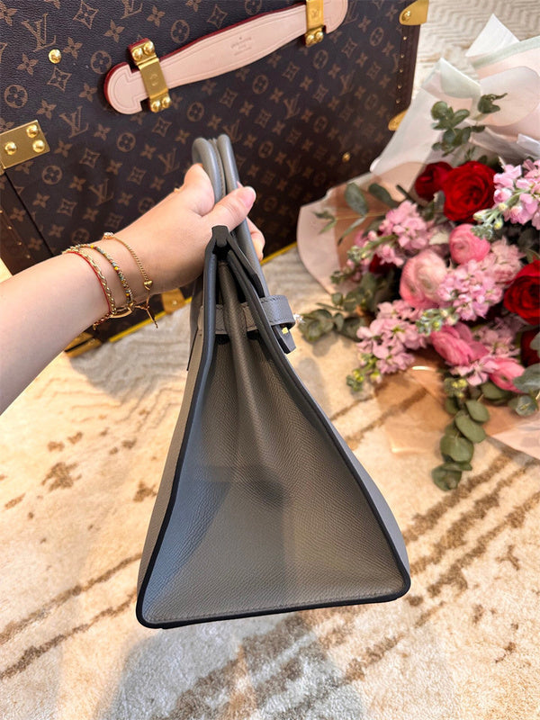 Side view of graceful structured handbag
