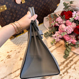 Side view of graceful structured handbag