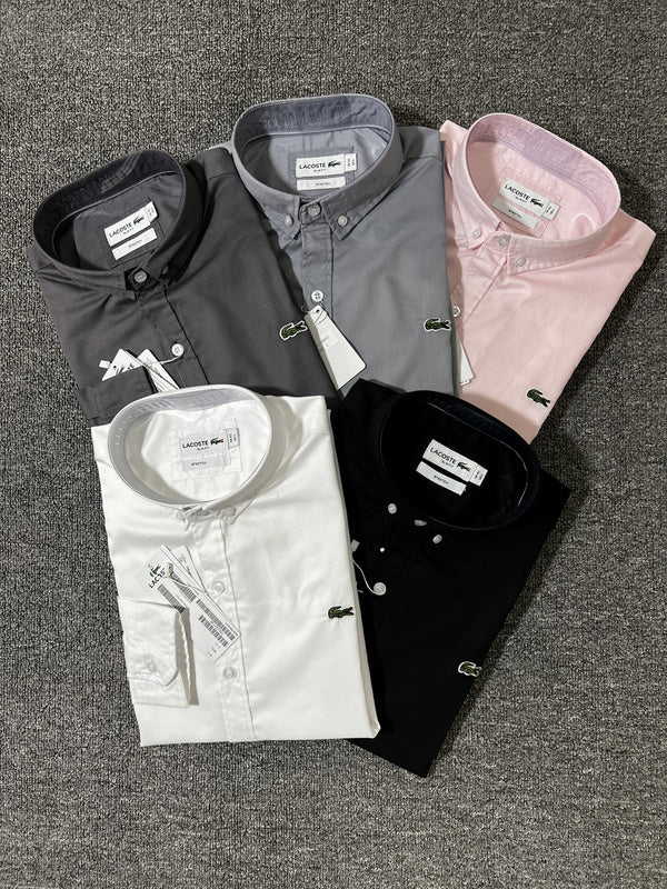 Flat lay presentation of Lacoste luxury clothing with logo-detail design