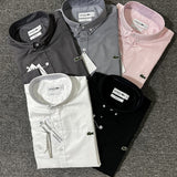 Flat lay presentation of Lacoste luxury clothing with logo-detail design