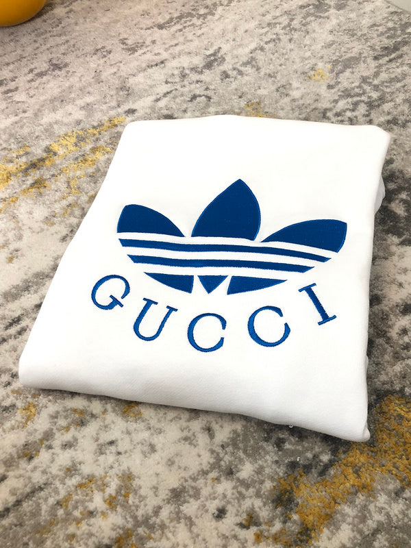 Side profile of Gucci luxury clothing with label-forward styling