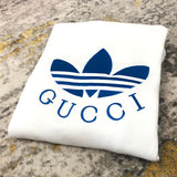 Side profile of Gucci luxury clothing with label-forward styling