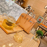 Side view of clean-lined structured handbag