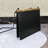 Side profile of sleek chic women's handbag – women's luxury accessory