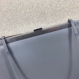 Handle and strap detail of elevated polished women's handbag – women's statement bag