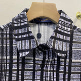 Close-up detail shot of Louis Vuitton luxury clothing with streetwear-inspired cut