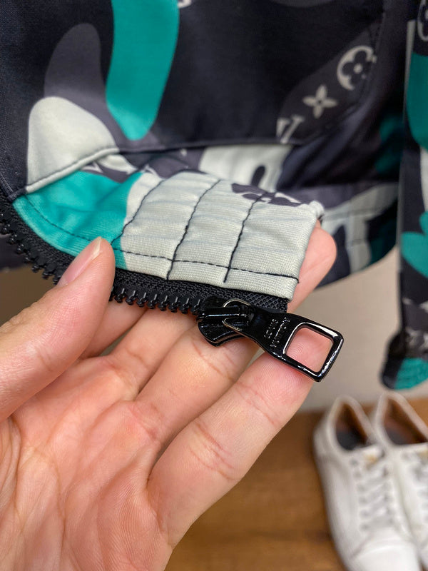 Flat lay presentation of Louis Vuitton luxury clothing with tailored silhouette