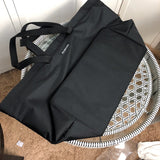 Styled lifestyle shot of elevated sleek women's handbag – women's luxury handbag