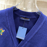 Flat lay presentation of Louis Vuitton luxury clothing with signature branding