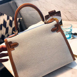  Signature crossbody bag carried on shoulder 16