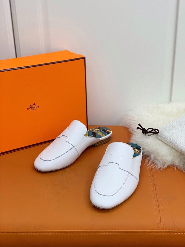 Hermès Black Loafer Flats - Angled View