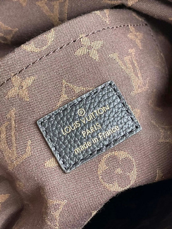 Side profile of everyday-luxe modern women's handbag – women's luxury accessory