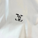 Back view of Louis Vuitton luxury clothing with tailored silhouette