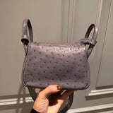 Side view of considered structured handbag