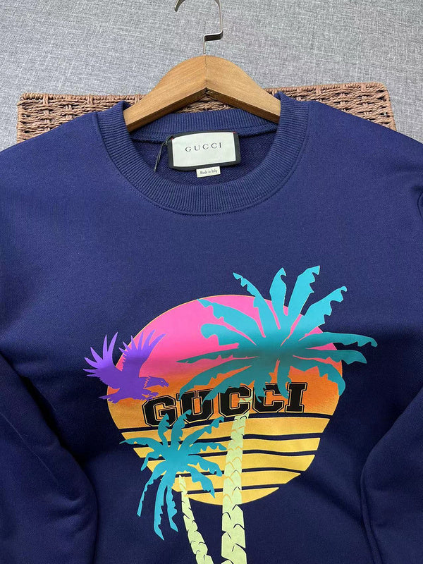 Flat lay presentation of Gucci luxury clothing with signature branding