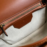 Side view of refined structured handbag