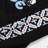 Close-up detail shot of Rhude luxury clothing with signature branding