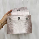 Side view of sculpted structured handbag