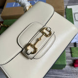 Styled lifestyle shot of signature sleek women's handbag – women's luxury accessory