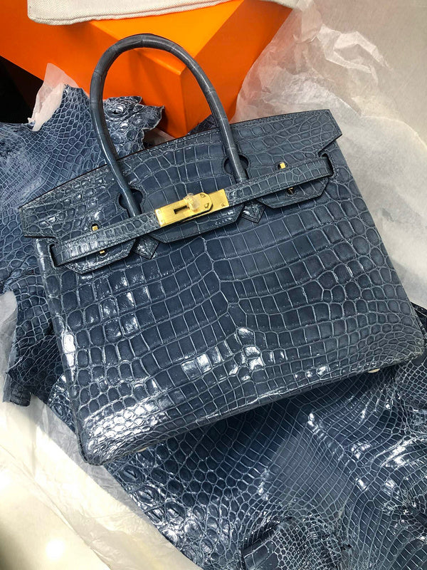 Side view of polished structured handbag