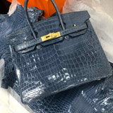 Side view of polished structured handbag