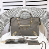Front view of sleek polished women's handbag – women's luxury accessory