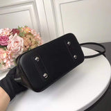Handle and strap detail of classic signature women's handbag – women's luxury handbag