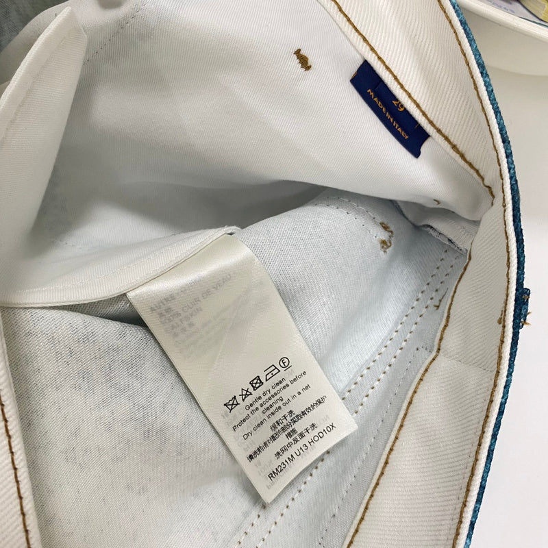 Close-up detail shot of Louis Vuitton luxury clothing with signature branding