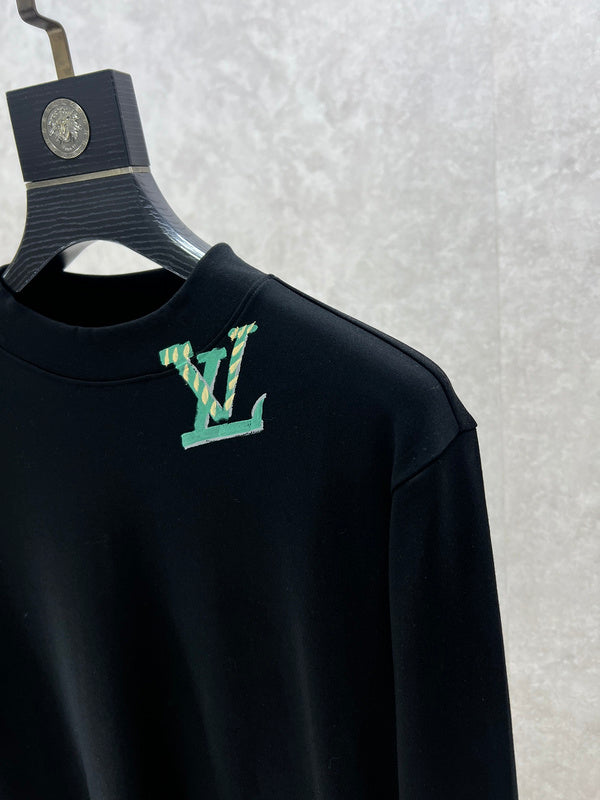 Flat lay presentation of Louis Vuitton luxury clothing with monogram-inspired silhouette