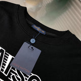 Close-up detail shot of Louis Vuitton luxury clothing with signature branding