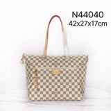 Side profile of signature polished women's handbag – women's everyday handbag