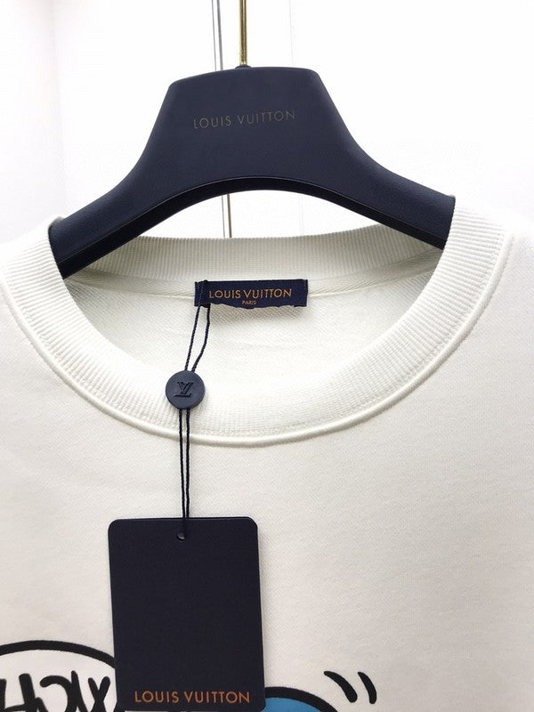 Flat lay presentation of Louis Vuitton luxury clothing with runway-inspired design