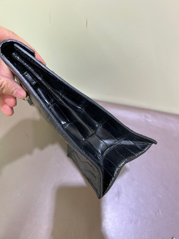 Side view of considered structured handbag